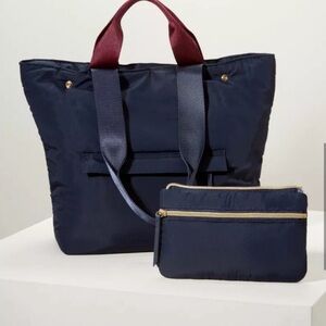- New in package Stella dot zip it convertible navy. Removable zip pouch